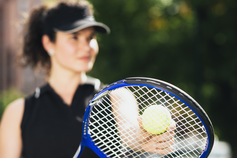 young-tennis-player-preparing-serve